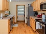Fully equipped kitchen with microwave, coffee maker, and toaster 